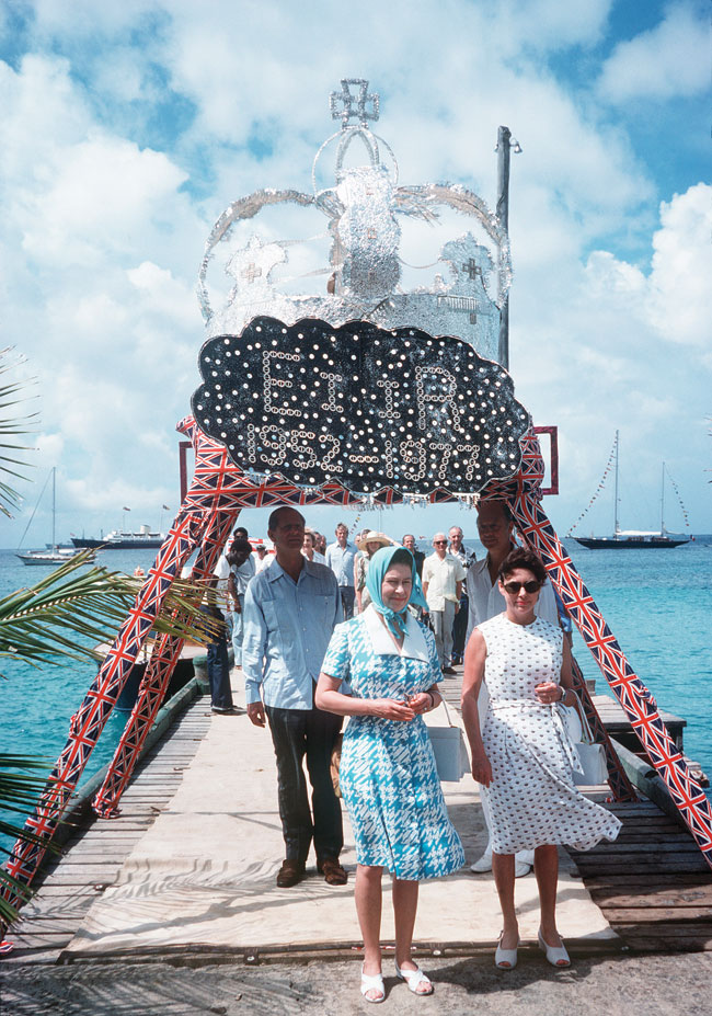 The Queen is welcomed by Princess Margaret as she arrives on Mustique.