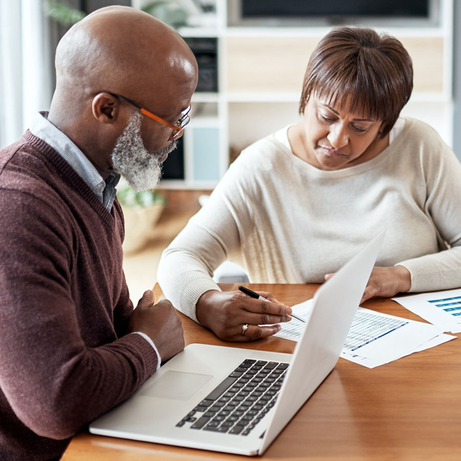 Cropped shot of a senior couple sitting together and going over their financial documents together in their home.