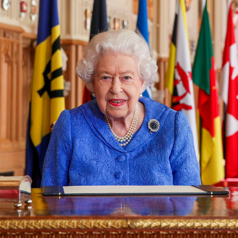 WINDSOR, UNITED KINGDOM: In this undated image released on March 7, 2021, Queen Elizabeth II signs her annual Commonwealth Day Message in St George&#039;s Hall at Windsor Castle, to mark Commonwealth Day, in Windsor, England.