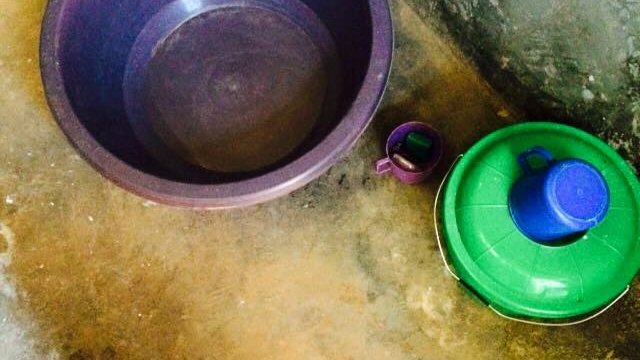 Bucket bath in Malawi