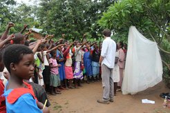 Teaching about mosquito net use