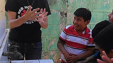 Allyson with kids of the school.