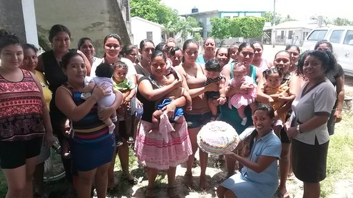 PCV Loryann and mothers in village