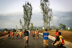 Tingaja walking after collecting lusekwane shrubs