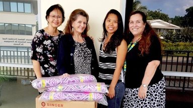 Phevee with supplies donated from IWG