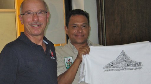 John Sacklin and a collaborator hold up a new interpretive shirt.