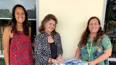 AJ and IWG during handover at Peace Corps office