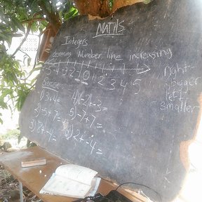 Teaching Grade 8 Math under the mango tree.