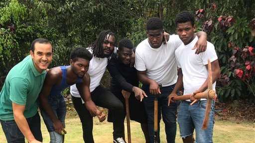 Education sector Volunteer Amine Chriyaa hangs out with a fellow volunteer and attendees of Camp Respect, a Peace Corps Youth