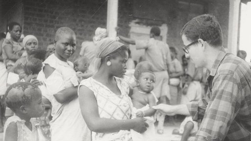 In 1965, PCV Art checks the weight of a Malawian baby.