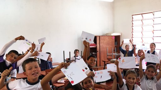 Fourth grade students at the Escuela Basica show off their finished personal flags, an activity meant to address self-esteem through expression.