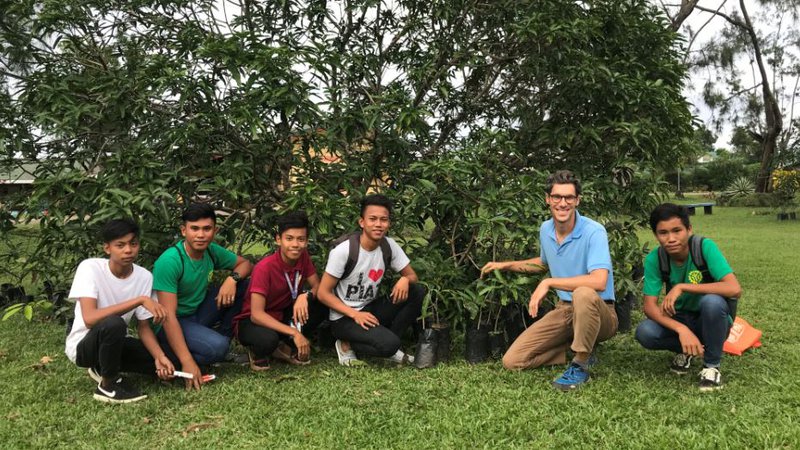Charles Reilly with students in the Philippines