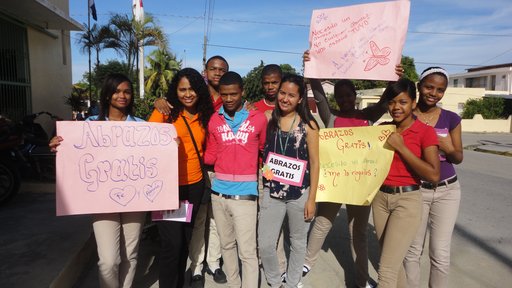 This activity was "Free Hugs Day," in which students and volunteer gave free hugs to community members and brochures to prevent violence and promote peace.
