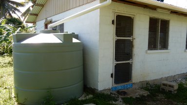 Volunteer house with water tank