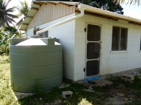 Volunteer house with water tank