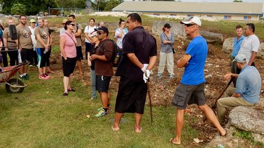 Peace Corps Volunteers join volunteers from other countries to learn about a piece of Tongan history.