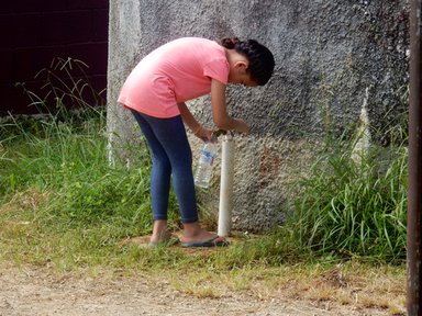 Taking a water break at the school water tank