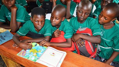 Pupils read a book on DEAR Day.JPG
