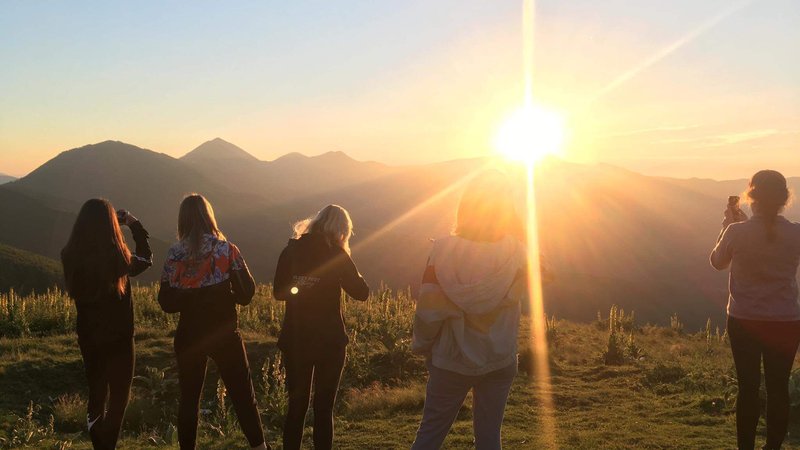 Campers enjoy the sunset on their first night of GLOW