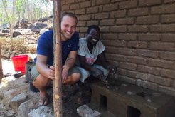 Volunteers and community counterparts encourage the use of fuel efficient cook stoves