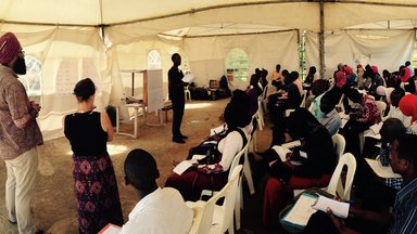 Peace Corps Volunteers facilitating a business plan session.jpg