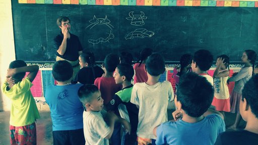G80 PCV teaches English, works on his stick figures