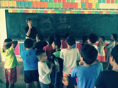 G80 PCV teaches English, works on his stick figures