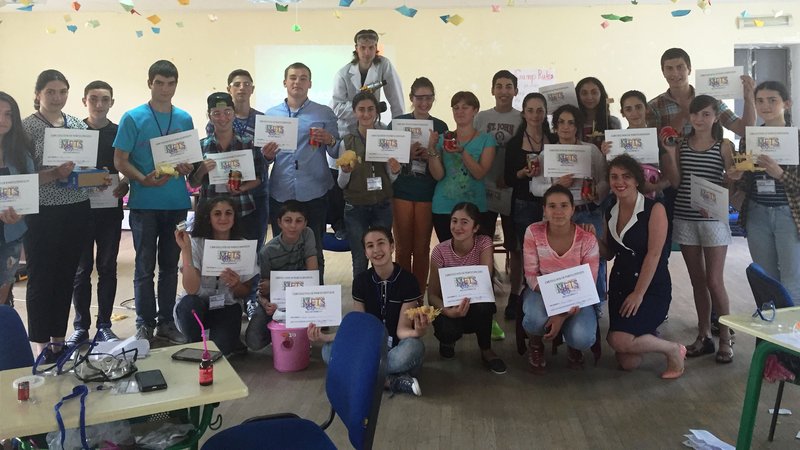 Students holdig METS certificates