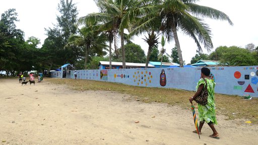 Enter The completed mural spans the entire southern boundary of the school. alt text