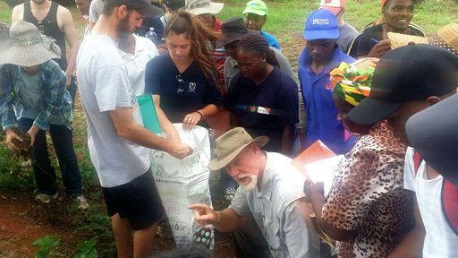 Volunteers participate in a permagarden training along with their counterparts.