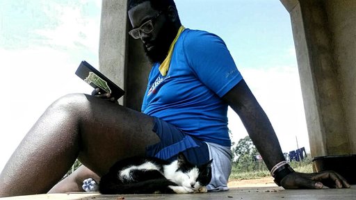 Life on the homestead consists of reading outside next to the cat after a good morning run through the community.