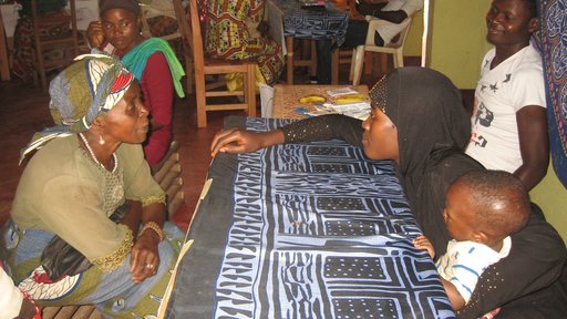 Madam Yvette teaches the ABCs of HIV prevention to a group member