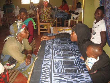 Madam Yvette teaches the ABCs of HIV prevention to a group member