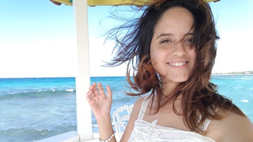 Latin/Hispanic female volunteer with hair blowing in wind during her Close of Service Ceremony