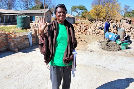 One of the nurses who decided not to retire when the new ward was built, standing on the foundation