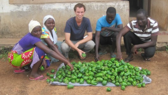 Peace Corps Volunteers Genevieve James and Ryan Ott introduced green peppers for the first time to a village in Ghana.