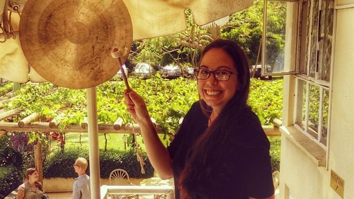Elyse “gonging out,” a tradition to mark the end of service and celebrate becoming an official returned Peace Corps Volunteer, from service in Uganda.