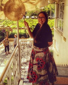 Elyse “gonging out,” a tradition to mark the end of service and celebrate becoming an official returned Peace Corps Volunteer, from service in Uganda.