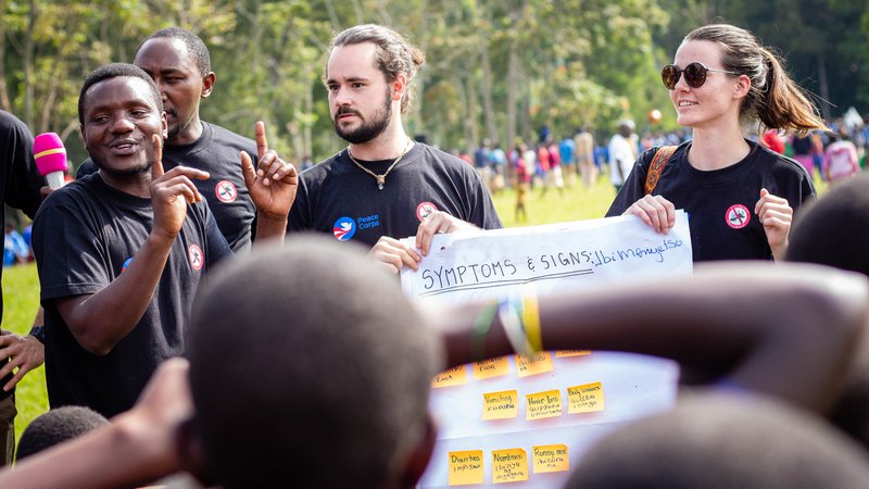 PCVs deliver a message to student onlookers