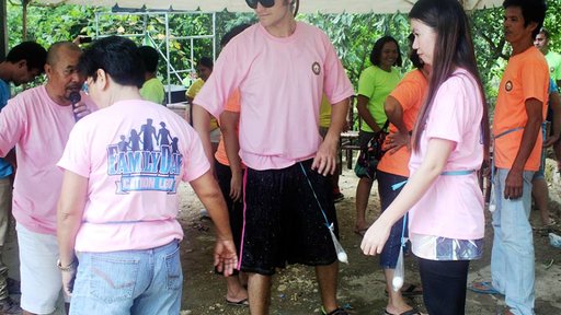 Playing a Filipino parlor game at Family Day
