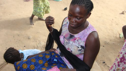 Sewing her first rice bag polypot.