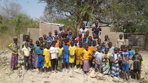 Laura Latrine - Students in front of their new latrines 2.jpg