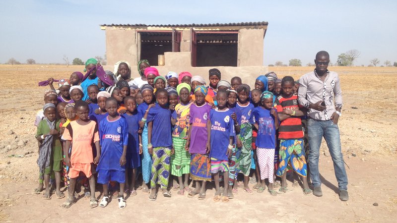 Laura Latrine - Students in front of their new latrines.JPG