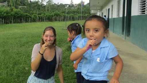 PCV Megan with child brushing their teeth.