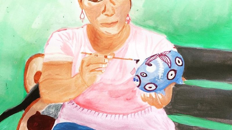 Abigail, an artisan and friend who paints piggy banks.