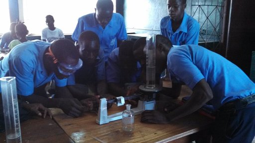 11th grade chemistry students measuring the density of water