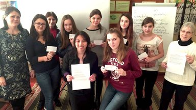 3. Volunteer Cynthia Katocs, right, helped organize the Costești workshop at the local public library.