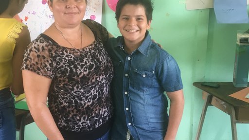 My student was so happy his mom was able to make it all the way from their community for his graduation