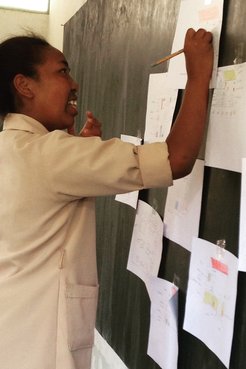 Girl drawing what she thinks is the ‘ideal’ latrine for girls to use when on their period at school