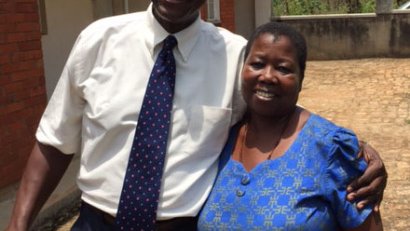 At age 65, Karl Hubert is currently serving as a Peace Corps Volunteer in Uganda. Here he is pictured with one of his neighbo